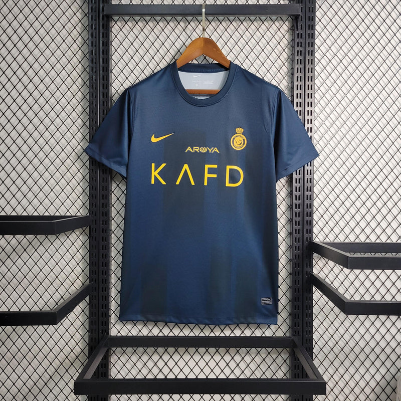 camisa-al-nassr-away-nike-23-24-ii-torcedor-azul-escuro-amarelo-cristiano-ronaldo-cr7-talisca-arabia