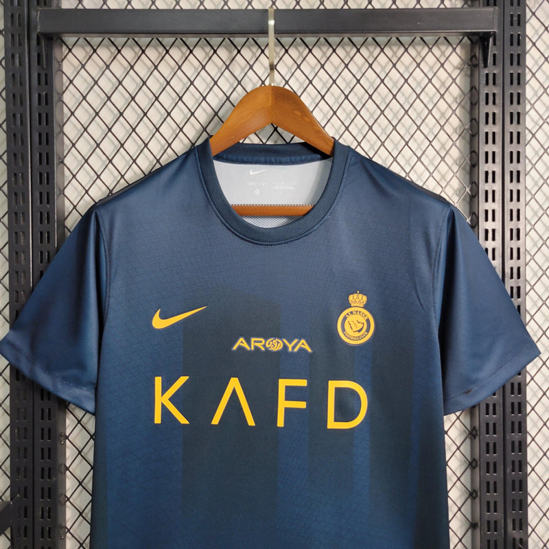 camisa-al-nassr-away-nike-23-24-ii-torcedor-azul-escuro-amarelo-cristiano-ronaldo-cr7-talisca-arabia