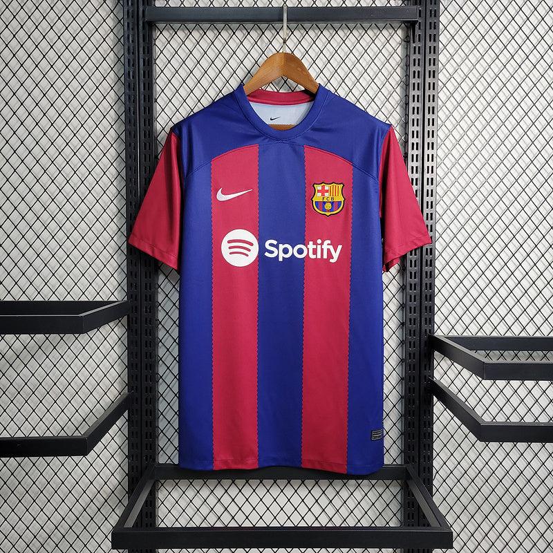 camisa-barcelona-home-23-24-nike-titular-torcedor-vermelho-grena-azul-branco-spotify