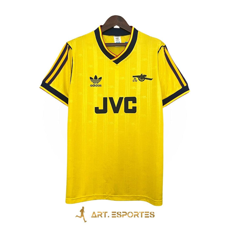 camisa-arsenal-away-II-reserva-86-88-amarelo-listras-brilhantes-cabide-fundo-branco-JVC-adidas-gunners-manga-curta-gola-v-uniforme-2