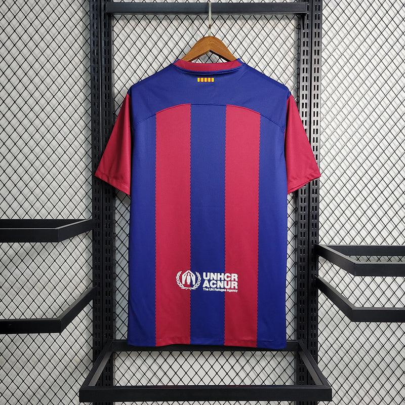 camisa-barcelona-home-23-24-nike-titular-torcedor-vermelho-grena-azul-branco-spotify