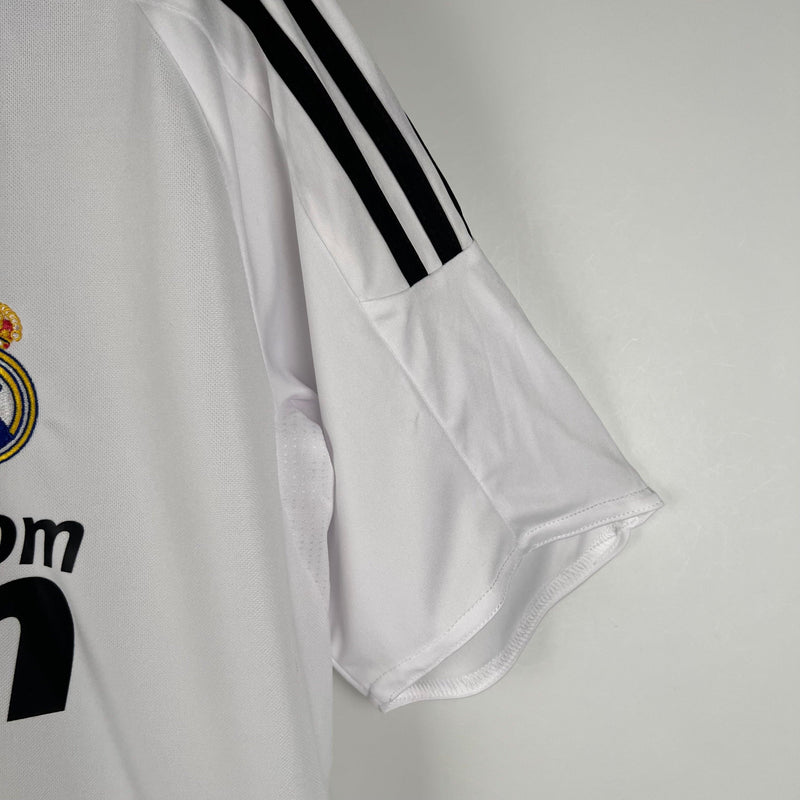 camisa-real-madrid-titular-I-home-gola-polo-branco-preto-manga-curta-gola-v-2008-2009-higuain-sergio-ramos