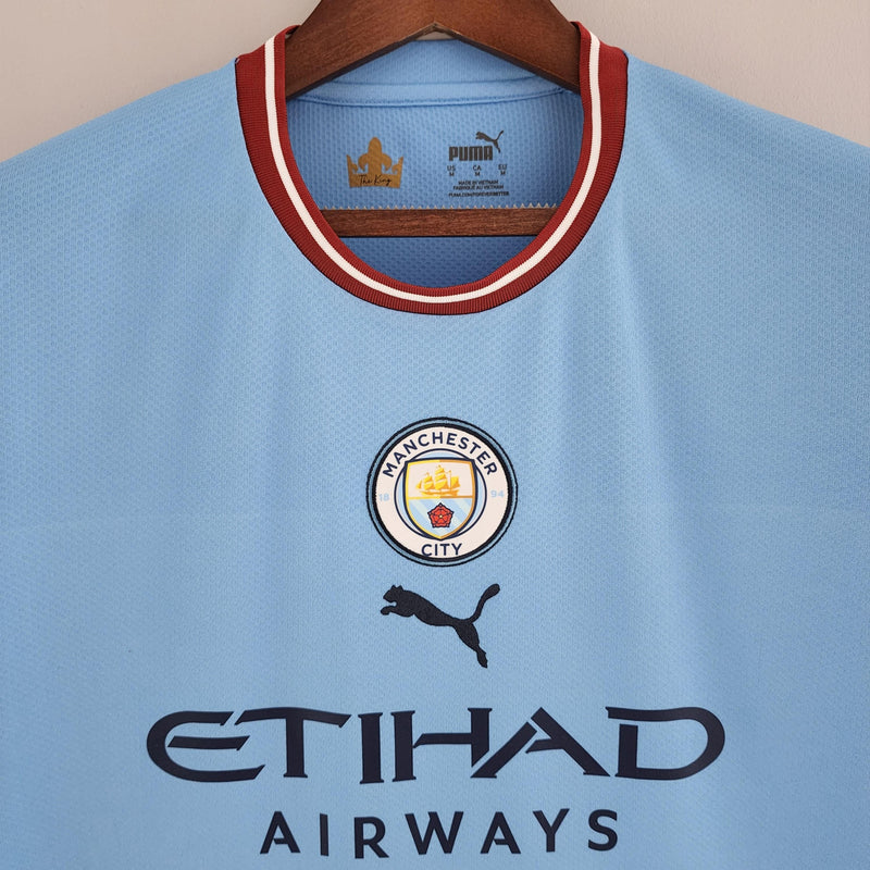 camisa-manchester-city-22-23-torcedor-home-titular-casa-erling-haaland-puma-azul-branco-grená