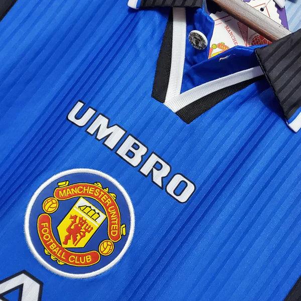 camisa-manchester-united-third-III-retrô-1996-1997-azul-branco-preto-gola-preta-reserva