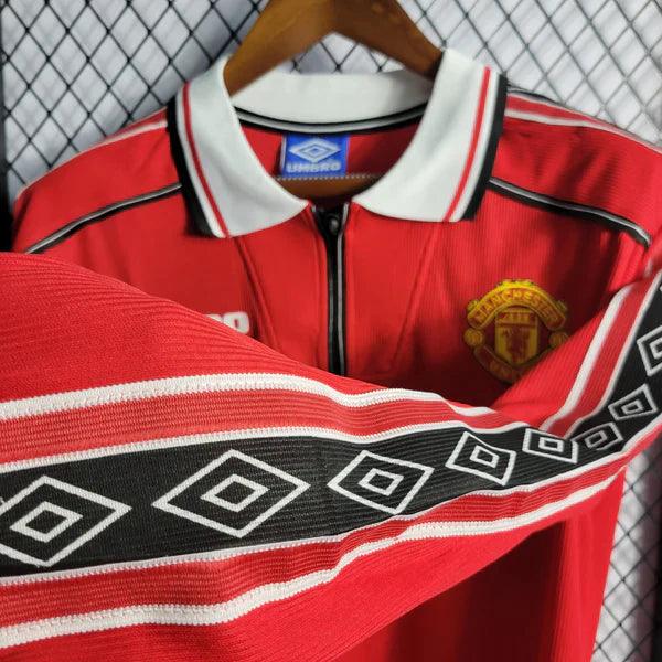 camisa-manchester-united-titular-I-manga-longa-retrô-gola-polo-manga-vermelha-preta-branca-sharp-umbro-1998-1999