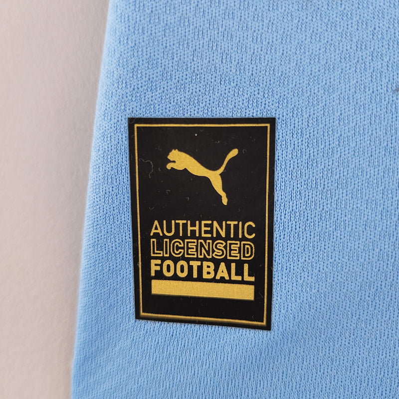 camisa-manchester-city-22-23-torcedor-home-titular-casa-erling-haaland-puma-azul-branco-grená