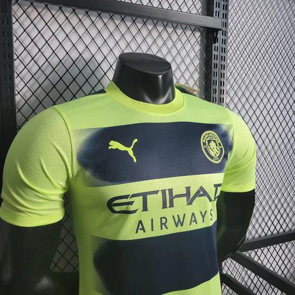 camisa-manchester-city-third-22-23-verde-preto-reserva-versão-jogador-puma-silk-emborrachado-manga-curta-grade-manequim