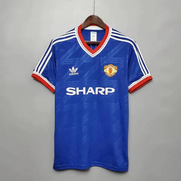 camisa-manchester-united-third-III-away-reserva-azul-golaV-listras-branca-sharp-retrô-manga-curta-vermelha-brilhante-detalhes