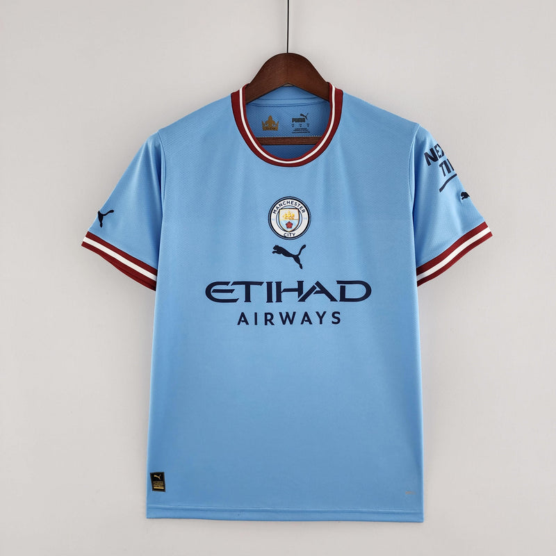 camisa-manchester-city-22-23-torcedor-home-titular-casa-erling-haaland-puma-azul-branco-grená