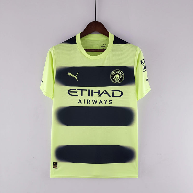 camisa-manchester-city-third-away-torcedor-22-23-erling-haaland-kevin-de-bruine-bernardo-silva-ederson-cancelo-amarelo-preto-verde