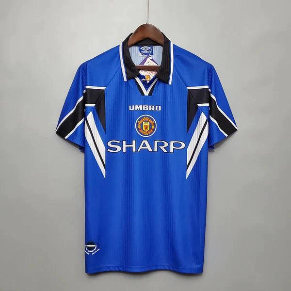 camisa-manchester-united-third-III-retrô-1996-1997-azul-branco-preto-gola-preta-reserva