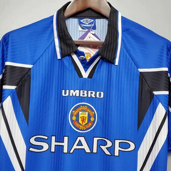 camisa-manchester-united-third-III-retrô-1996-1997-azul-branco-preto-gola-preta-reserva