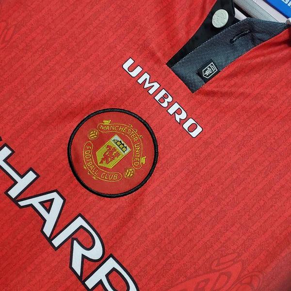 camisa-manchester-united-I-titular-1996-vermelho-gola-polo-branco-preto