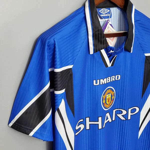 camisa-manchester-united-third-III-retrô-1996-1997-azul-branco-preto-gola-preta-reserva