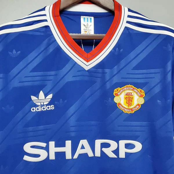 camisa-manchester-united-third-III-away-reserva-azul-golaV-listras-branca-sharp-retrô-manga-curta-vermelha-brilhante-detalhes