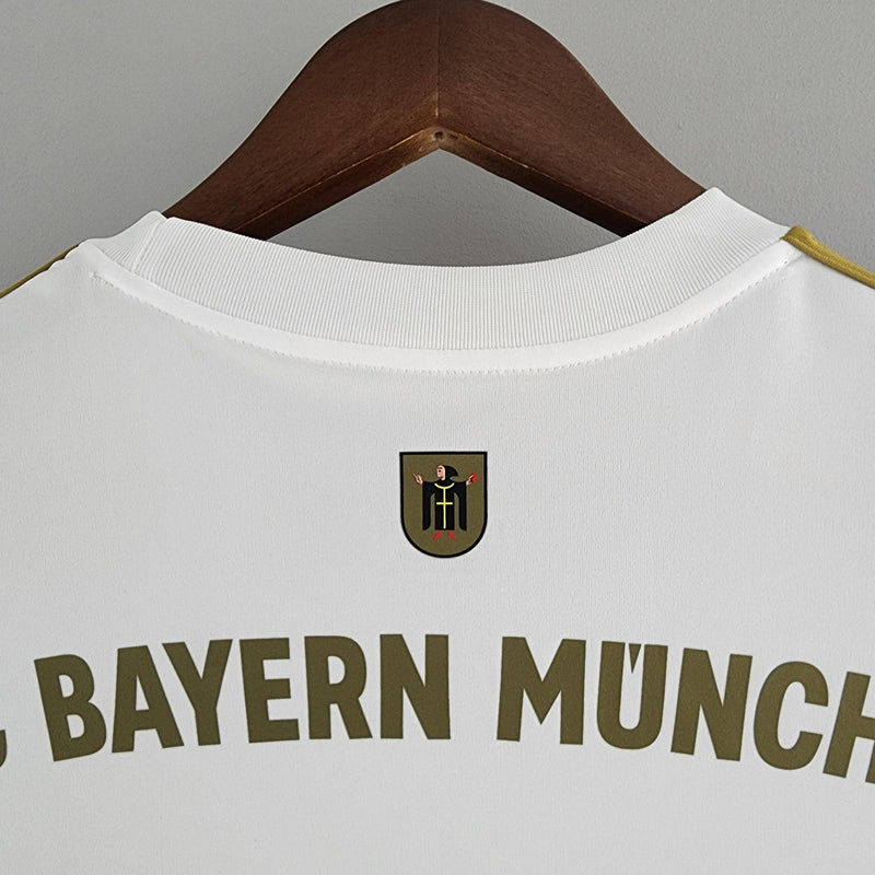 camisa-bayern-de-munique-away-ll-versão-torcedor-adidas-branco-dourado-23-24-harry-kane-thomas-muller-vidovic