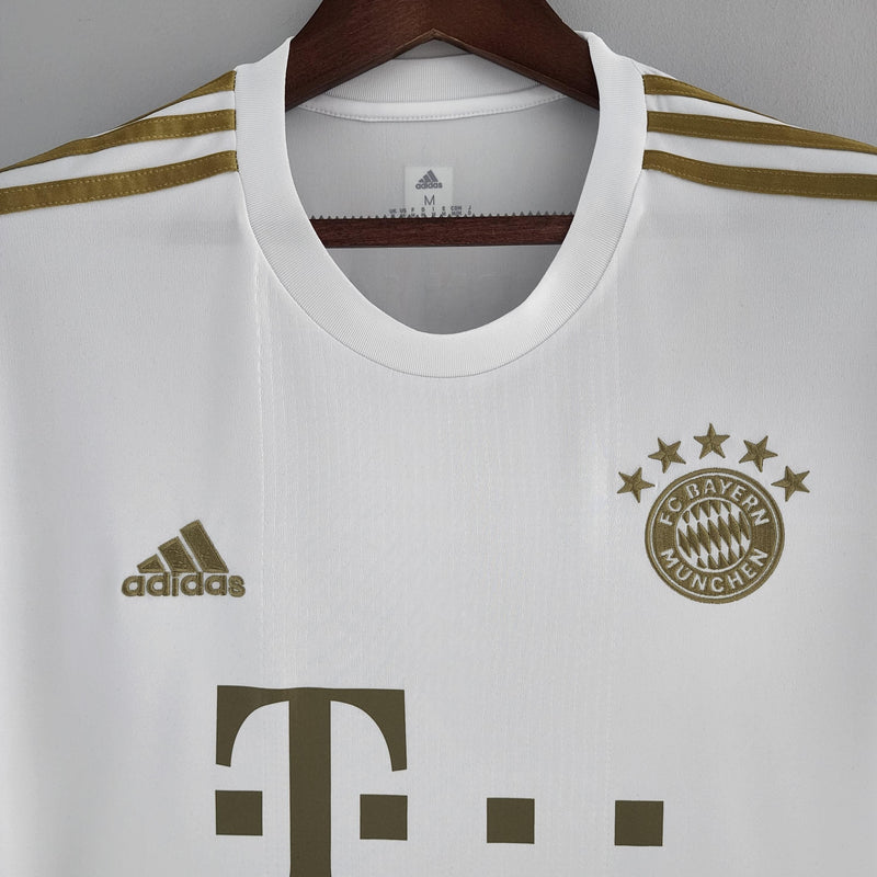 camisa-bayern-de-munique-away-ll-versão-torcedor-adidas-branco-dourado-23-24-harry-kane-thomas-muller-vidovic