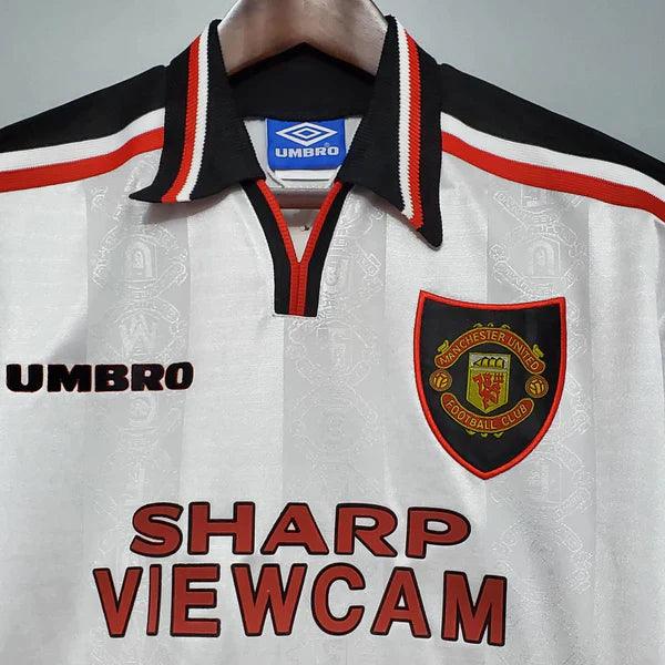 camisa-manchester-united-retrô-sharp-viewcam-gola-polo-preta-umbro-branca-1997-1998-reserva-II-cantona-fundo-branco