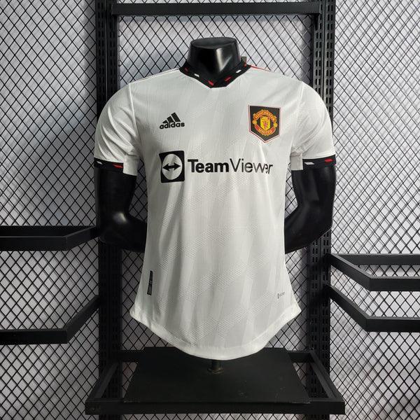 camisa-manchester-united-II-reserva-branco-22-23-versao-jogador-manga-curta-detalhes-gola-v-silkado-silk-emborrachado-grade-fundo