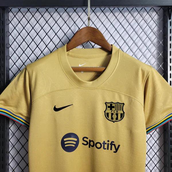 camisa-barcelona-feminina-away-22-23-dourado-preto-versao-torcedor