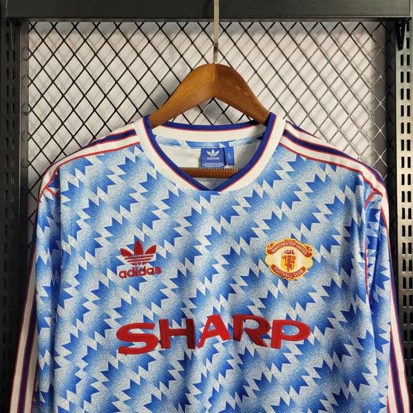 camisa-manchester-united-manga-longa-retrô-away-1990-1992-azul-listras-branca-punho-eslastico-gola-v-bordado-fundo-grade