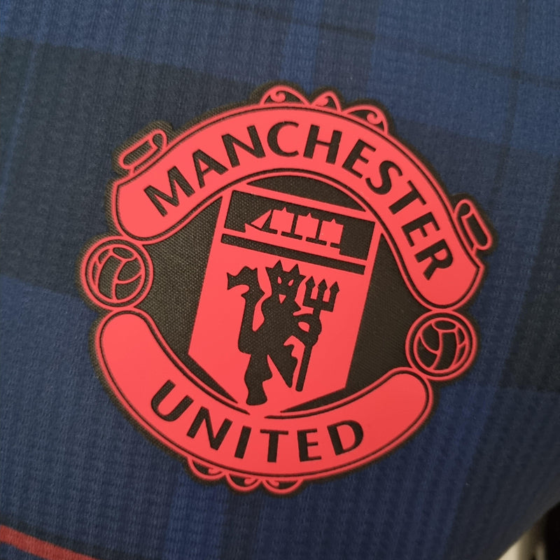 camisa-manchester-united-azul-royal-gola-polo-versão-jogador-silk-manga-curta-logo