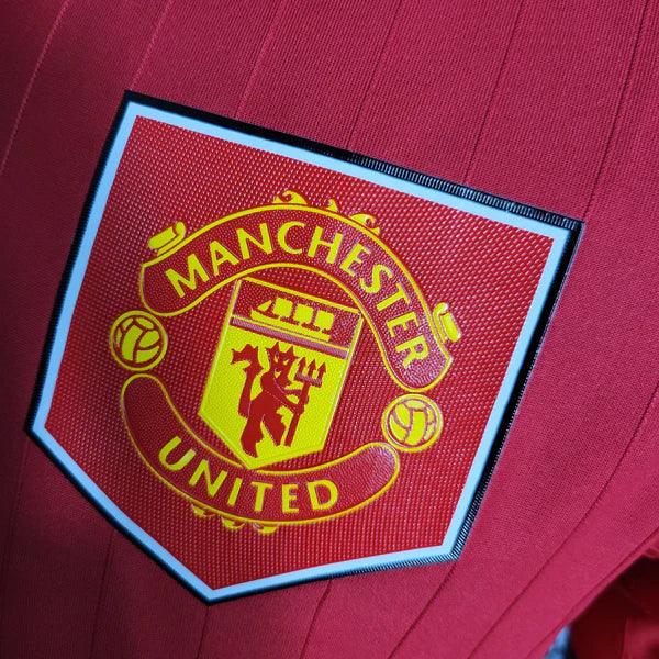 camisa-manchester-united-I-titular-versão-jogador-gola-polo-vermelho-branco-grade-fundo-detalhes-silkado-emborrachado